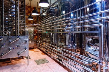 Vats for fermentation. Craft beer production line in modern brewery