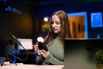 Gen Z content creator reviews large capacity V mount battery used to power high end devices on...