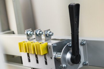 High voltage switch lever. Bolted contact electrical connection in a switchboard power plant. Electrical power engineering topics. Selective focus.