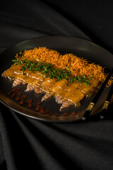 delicious S A S H I M I on a black plate