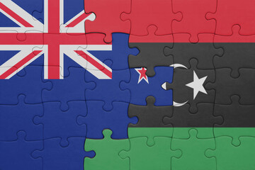 puzzle with the colourful national flag of libya and flag of new zealand.