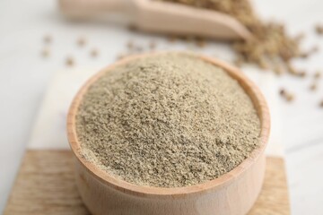 Aromatic spice. Ground pepper in bowl on white table, closeup