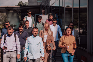 A diverse group of businessmen and colleagues walking together by their workplace, showcasing...