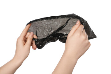 Woman holding black shoe cover on white background, closeup