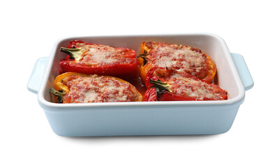 Tasty stuffed peppers in dish isolated on white