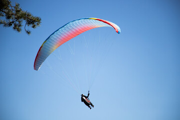 glider paragliding g against blue sky flying adrenaline and freedom concept