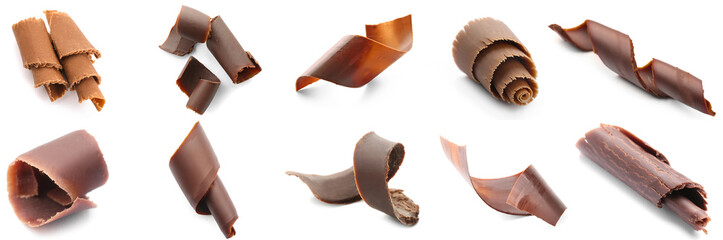 Set of sweet chocolate curls on white background