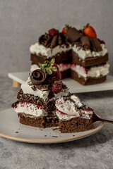 Sweet homemade chocolate cake strawberries and cream