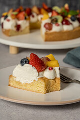 Sweet homemade fresh fruit cake with cream