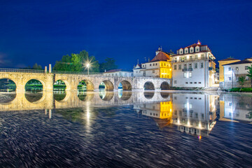 Ponte de Trajano reflected on Tamega river in Chaves, Portugal..
