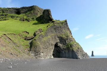 vertical basalt columns at Reynisfjara, the famous black beach in Iceland, near Vík í Myrdal,...
