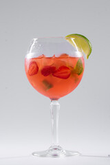 fresh red mojito cocktail with strawberry, lime and mint with ice isolated