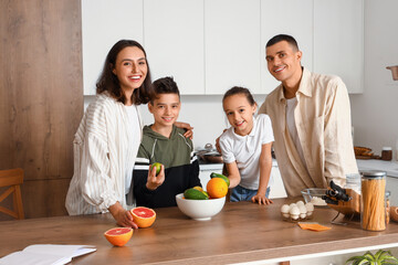 Happy family cooking in kitchen