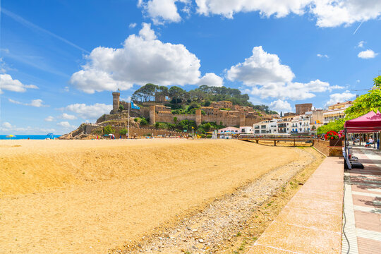 The 12th century walled Murallas de Tossa de Mar, a medieval castle with towers, fortified walls and the Vila Vella interior town, along the Costa Brava at Tossa de Mar, Spain. - Powered by Adobe