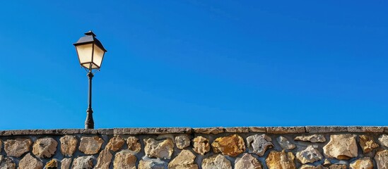A wall made of stone with a blue sky in the background
