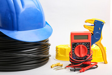 Different electrician's supplies on light background