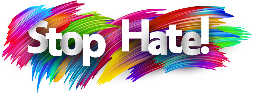 Stop hate paper word sign with colorful spectrum paint brush strokes over white.