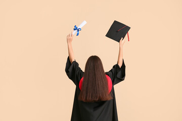 Female graduating student with diploma on beige background, back view