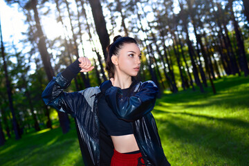 Fitness woman exercising in the park in early spring on fresh air.