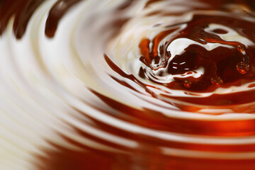 Macro shot of tea drink ripples as background