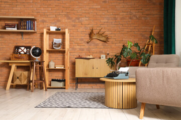 Interior of living room with drawers and vintage typewriter on table