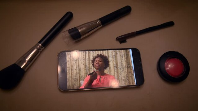 Produce an engaging makeup tutorial with beauty products, filmed on your smartphone for social media