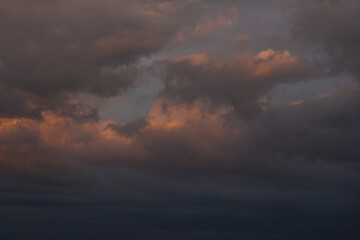 Rain clouds in the setting sun