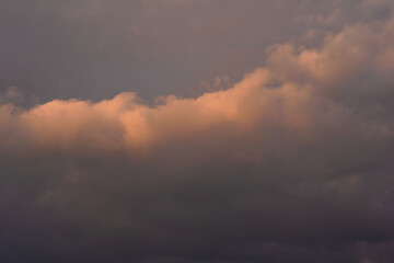 Rain clouds in the setting sun