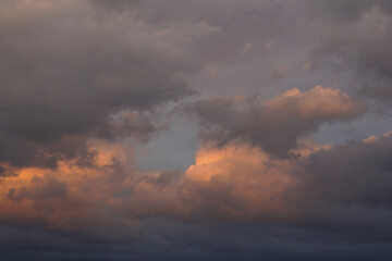 Rain clouds in the setting sun