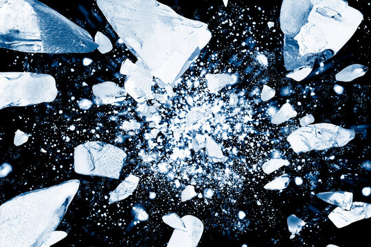 Crushed ice in air on black background