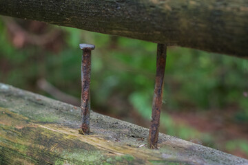 rusty nails in a fence