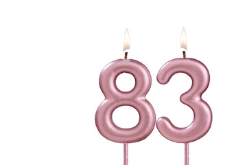 Lit birthday candle - Candle number 83 on white background