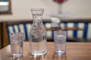 Water Jugs and Cups Restaurant Food Place Dining Table