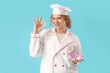 Female chef with tampons on blue background