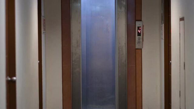 An empty elevator will arrive and the doors will open and close
