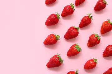 Many sweet fresh strawberries on pink background