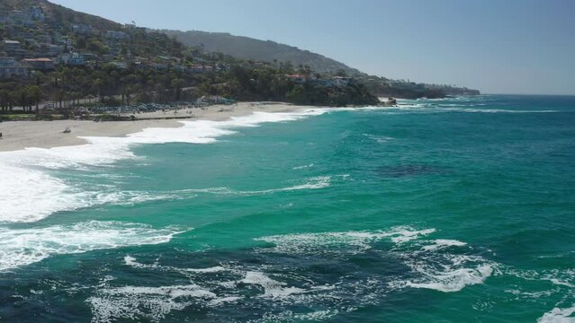 A Drone View Over the Ocean, Turning Toward the Beach in Laguna Beach