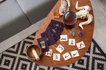 Witch's magic attributes on table in living room, top view