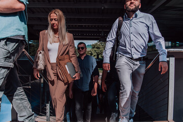 A diverse group of businessmen and colleagues walking together by their workplace, showcasing collaboration and teamwork in the company.