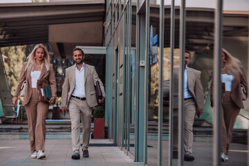Modern business couple after a long day's work, walking together towards the comfort of their home, embodying the perfect blend of professional success and personal contentment.