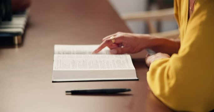 Woman, hands and reading a bible in home for worship, gratitude and information on God in living room. Christianity, person and holy book for faith, belief and spiritual by table in lounge of house
