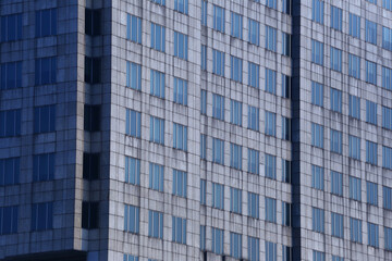 Big tall building background with windows and glass.