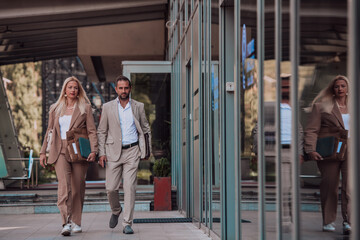 Modern business couple after a long day's work, walking together towards the comfort of their home, embodying the perfect blend of professional success and personal contentment.