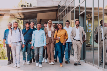 A diverse group of businessmen and colleagues walking together by their workplace, showcasing collaboration and teamwork in the company.