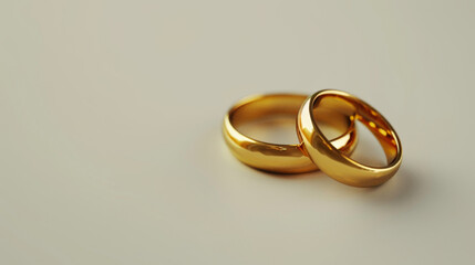Two golden wedding rings isolated on a white background