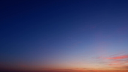 A beautiful gradient sky with deep blue transitioning to softer hues of purple and pink near the...
