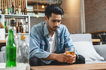 Alcoholism concept. Young man drinking alcohol too much.
