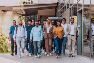 A diverse group of businessmen and colleagues walking together by their workplace, showcasing...