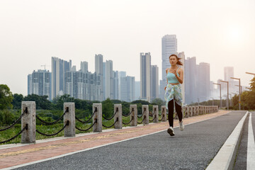 Young women wearing sportswear do warm-up morning runs and fitness exercises