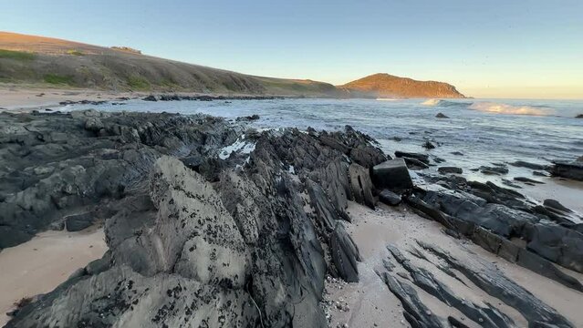Landscape 4k footage of the rocks and ocean in front of Rosetta Head on the Victor Harbor Heritage Trail on the Fleurieu Peninsula in South Australia